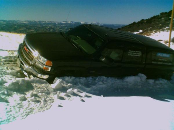 Company truck stuck in snow going on emergency service call
